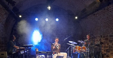 The photo shows a band playing a music